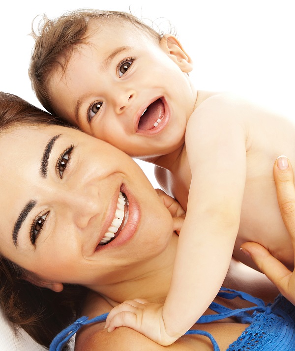 Mother holding a happy baby