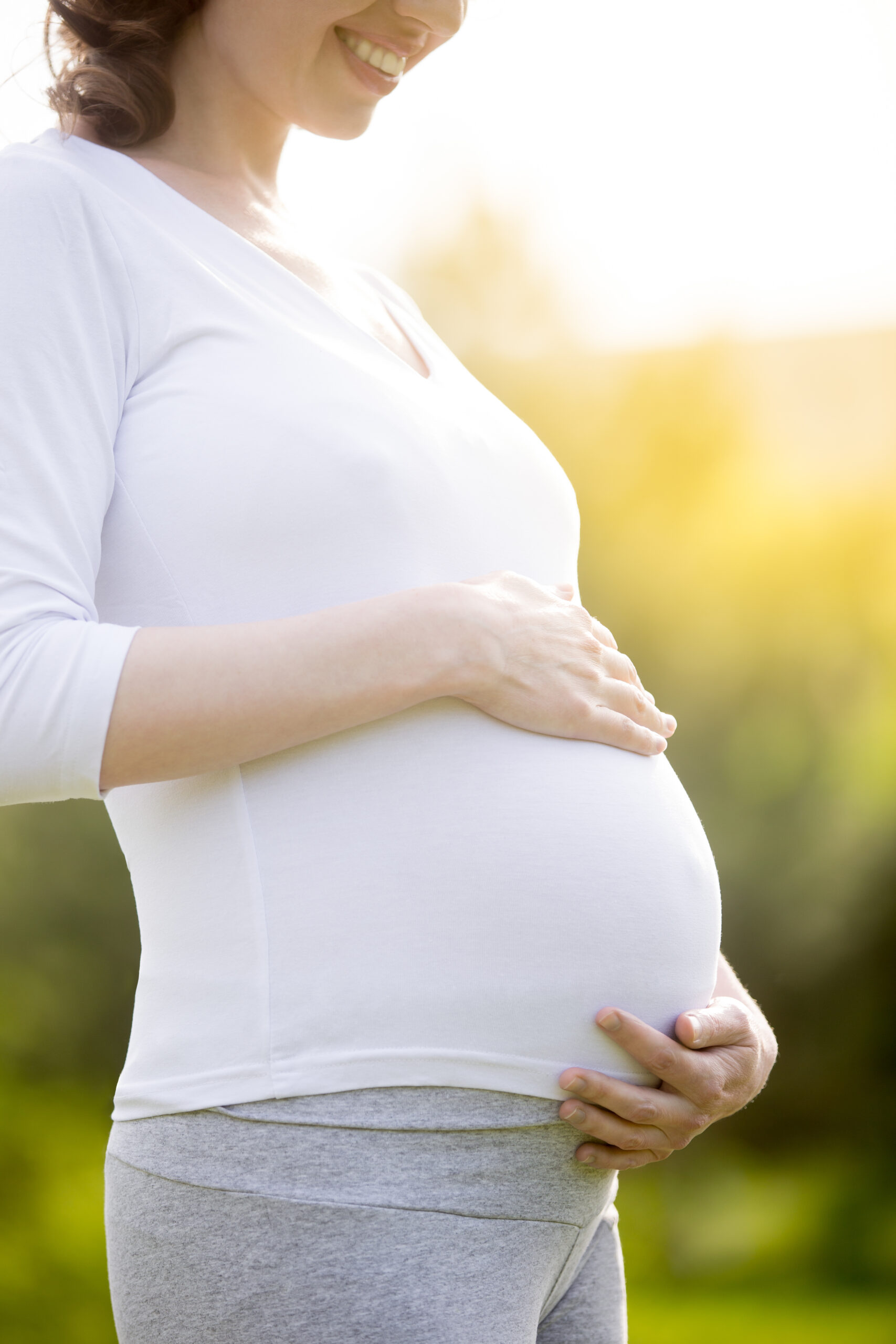 Pregnant mother representing outreach to growing families